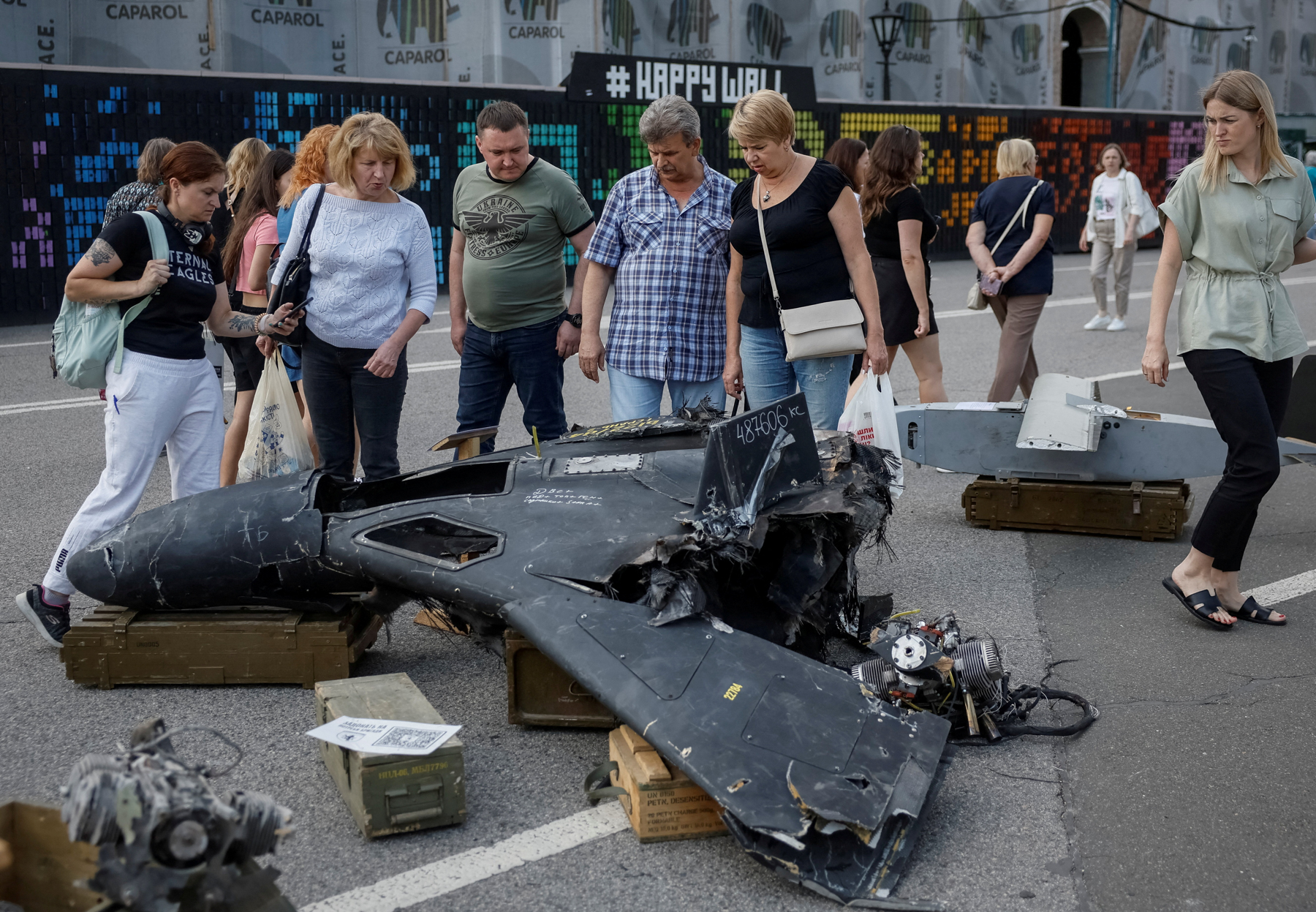 People look at a destroyed Russian combat drone during a visit to an exhibition in central Kiev dedicated to the defense of Chasovoy Yar, Ukraine